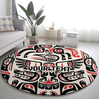 Round carpet with full-circle black, cream, and red totem design and 'YOURTEHT' lettering