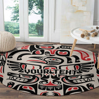 Round carpet with black, cream, and red totem motif and 'YOURTEHT' lettering