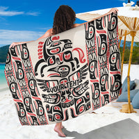Personalized Haida art sarong with black, white, and red totem-style print, draped