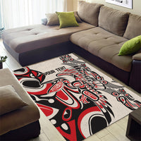 Rectangular area rug with red, black and cream tribal-style pattern and “YOUR TEHT”