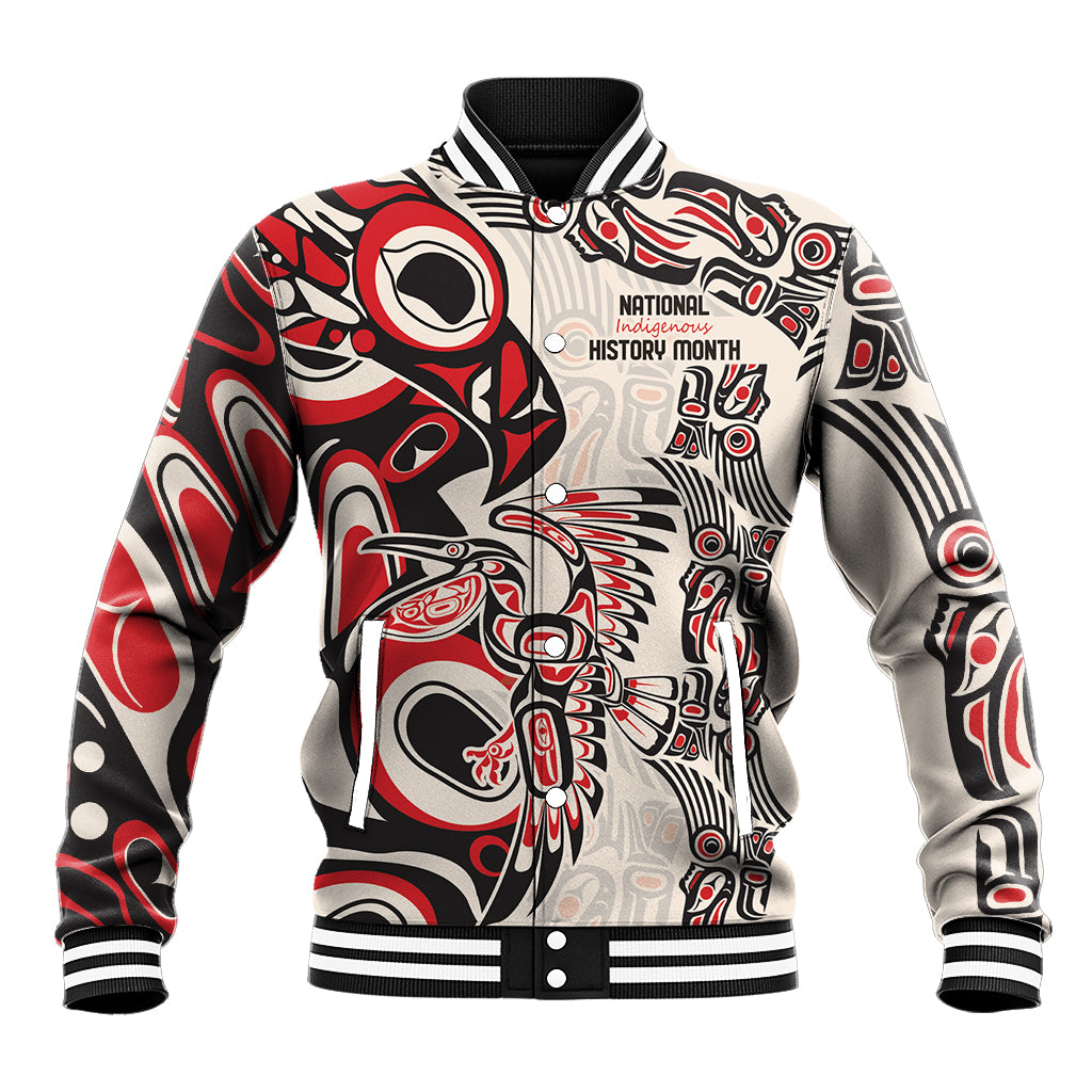 Red baseball jacket with black-and-white Indigenous graphic, ribbed collar and 'National...' patch.