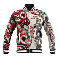 Red baseball jacket with black-and-white Indigenous graphic, ribbed collar and 'National...' patch.