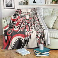 Personalized throw blanket over armchair, red/black/white abstract art with 'YOUR TEXT'