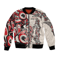 Red and white bomber jacket with black ribbed trim, front zipper, Native-inspired graphic print