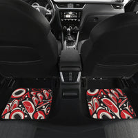 Car interior with two rear floor mats in red/black/white tribal pattern