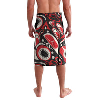 Red, black, and white patterned lavalava skirt with elastic waistband, side view