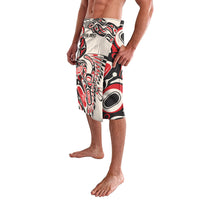 Red, black, and white patterned lavalava skirt with elastic waistband, front 3/4