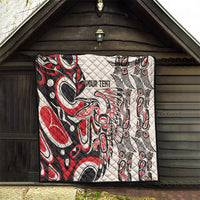 Personalized quilt in red, black, and white with “YOUR TEXT” and tribal eye-and-feather pattern