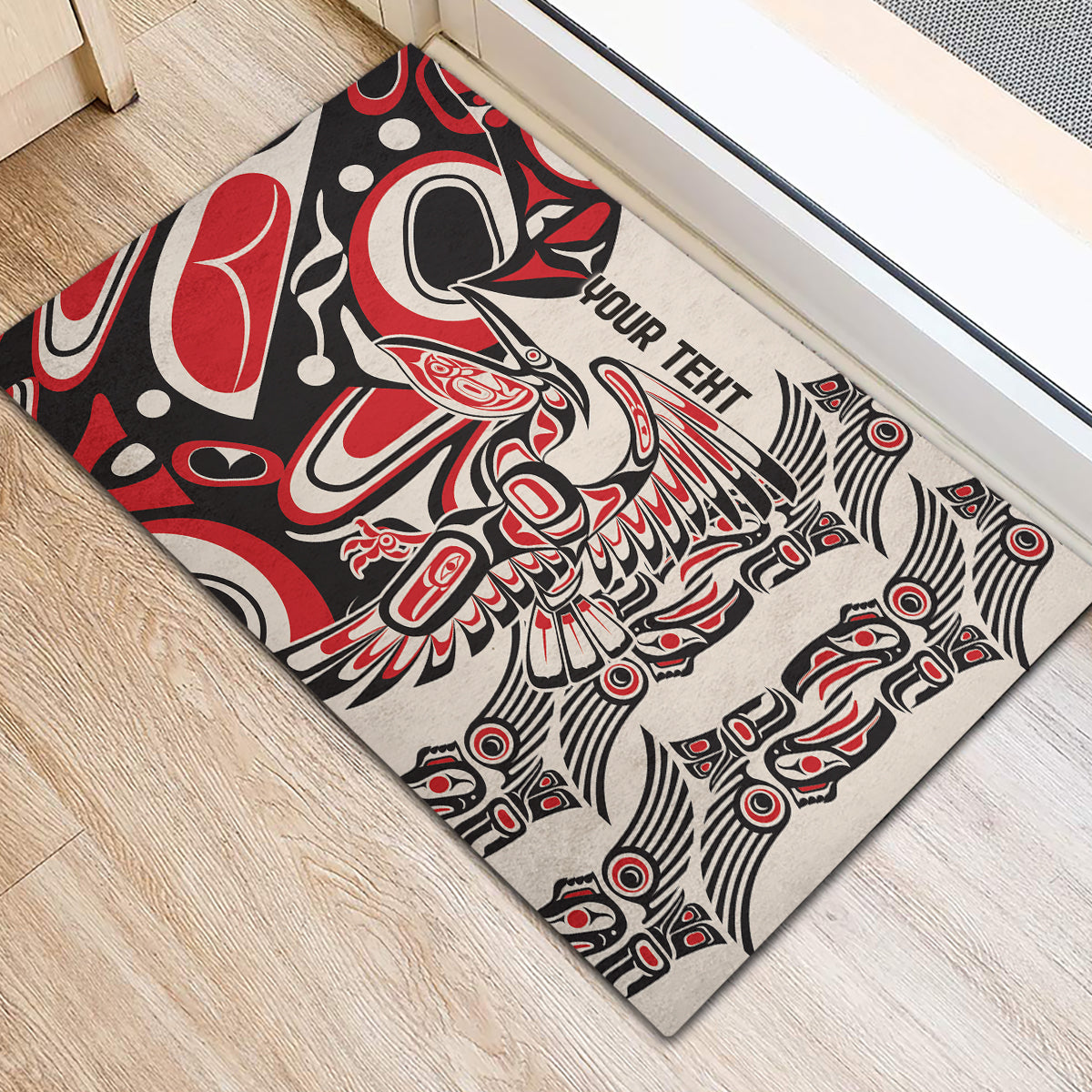 Personalized rubber doormat with red/black/white tribal artwork and centered 'YOUR TEXT'