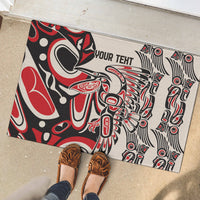 Personalized rubber doormat with red/black/white tribal print; 'YOUR TEXT' and shoes visible