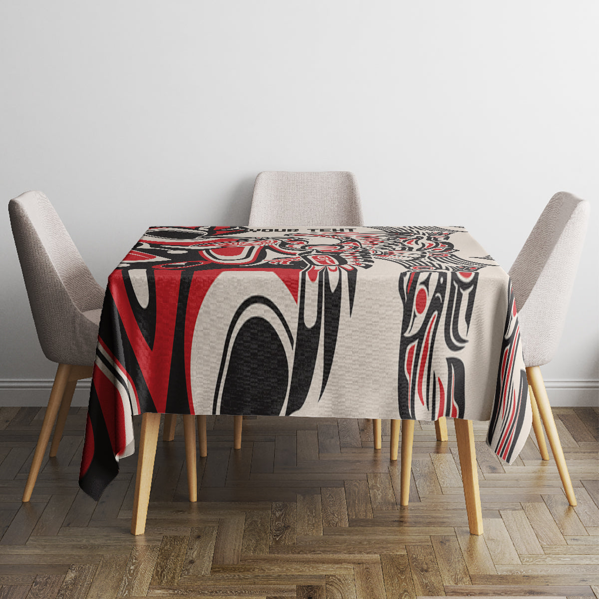 Square tablecloth in red, black, and white tribal pattern on table with four chairs.