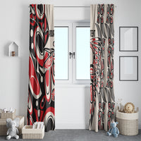 Red, black, and white tribal motif window curtains beside a white door