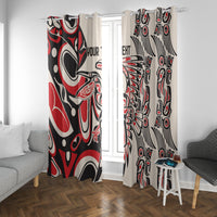 Red, black, and white tribal window curtain panels on a ceiling rod
