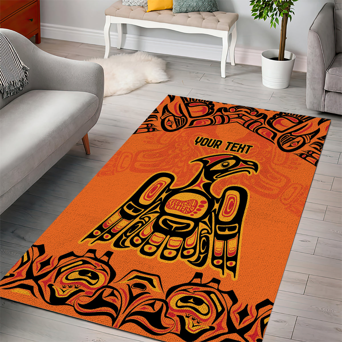 Orange tribal area rug with bold black eagle motif and 'YOUR TEHI' text, wide rectangle