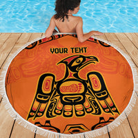 Orange circular beach blanket featuring tribal eagle figure, 'YOUR TEXT' and white fringed border