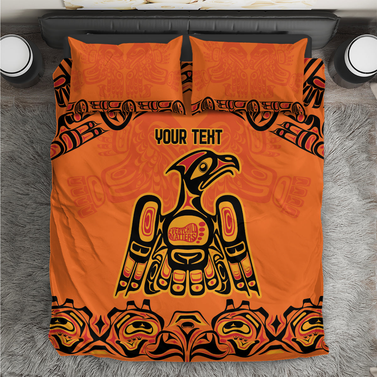 Orange bedding set with centered Haida-style animal print, two matching pillowcases