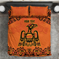 Orange bedding set with centered Haida-style animal print, two matching pillowcases