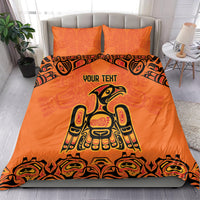 Orange personalized bedding set with centered Haida-style animal graphic and two matching pillows