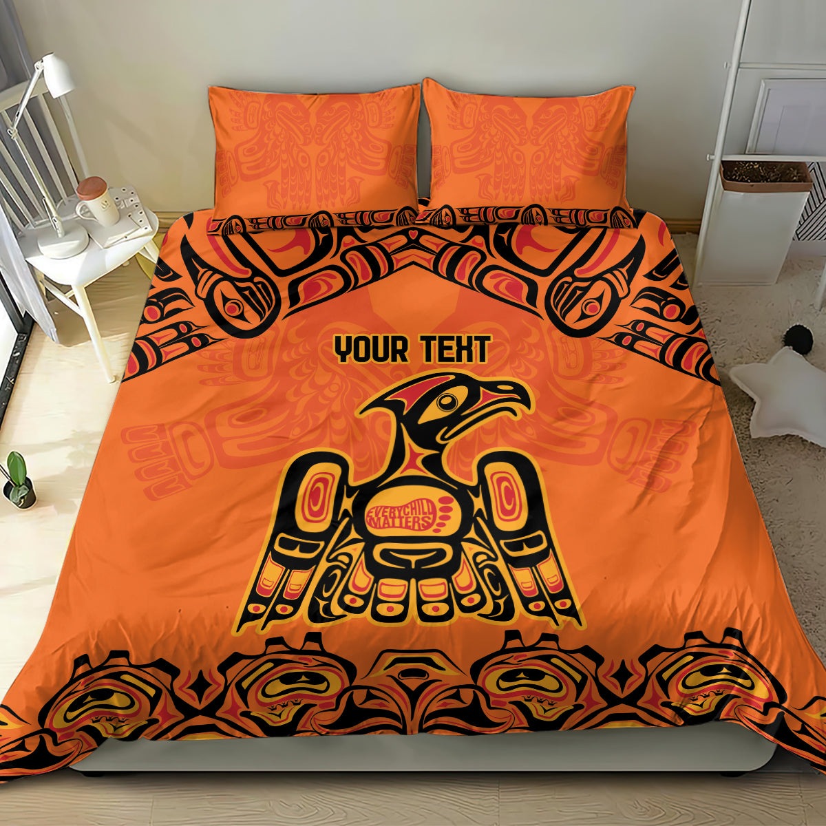 Orange bedding set with bold Haida-style animal design on duvet and two matching pillows