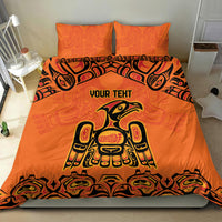 Orange bedding set with bold Haida-style animal design on duvet and two matching pillows