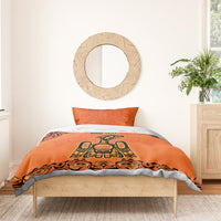 Orange personalized bedding set with bold Haida-style animal graphic and matching pillowcases