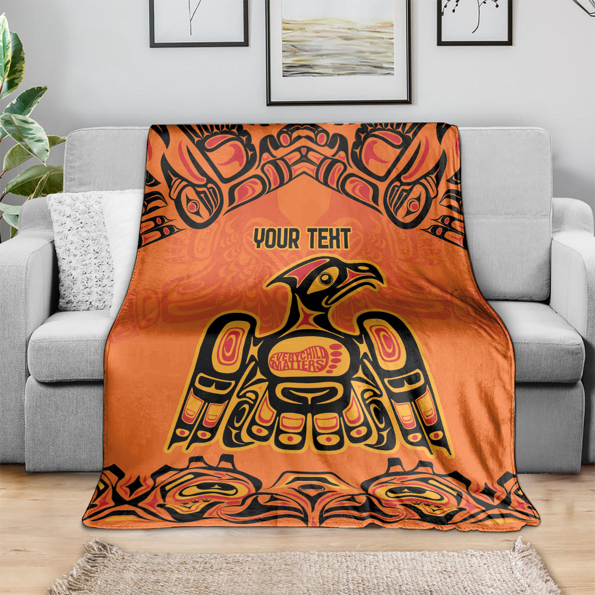 Orange patterned throw blanket with 'YOUR TEXT' and central 'Every Child Matters' badge