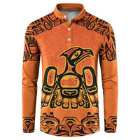 Orange button-front sweatshirt with Haida-style eagle and Every Child Matters emblem