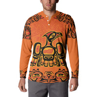 Orange button-front sweatshirt with tribal eagle front graphic and patterned long sleeves
