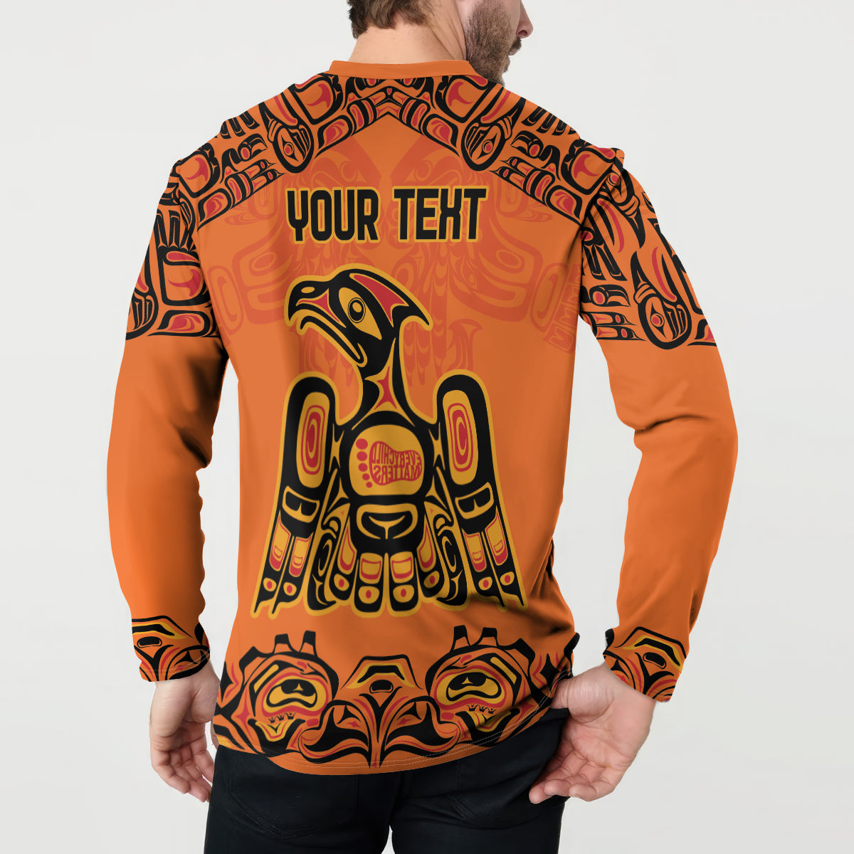 Orange button-front sweatshirt with “YOUR TEXT” back print and tribal eagle graphic