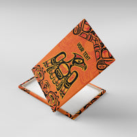 Orange canvas wall art with Native-style eagle graphic, shown at an angle.
