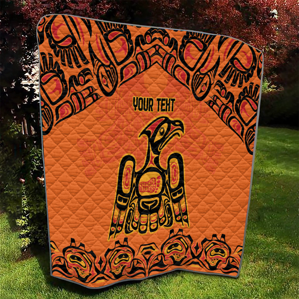 Orange quilt blanket with black border and Haida-style raven print, "YOUR TENT" text