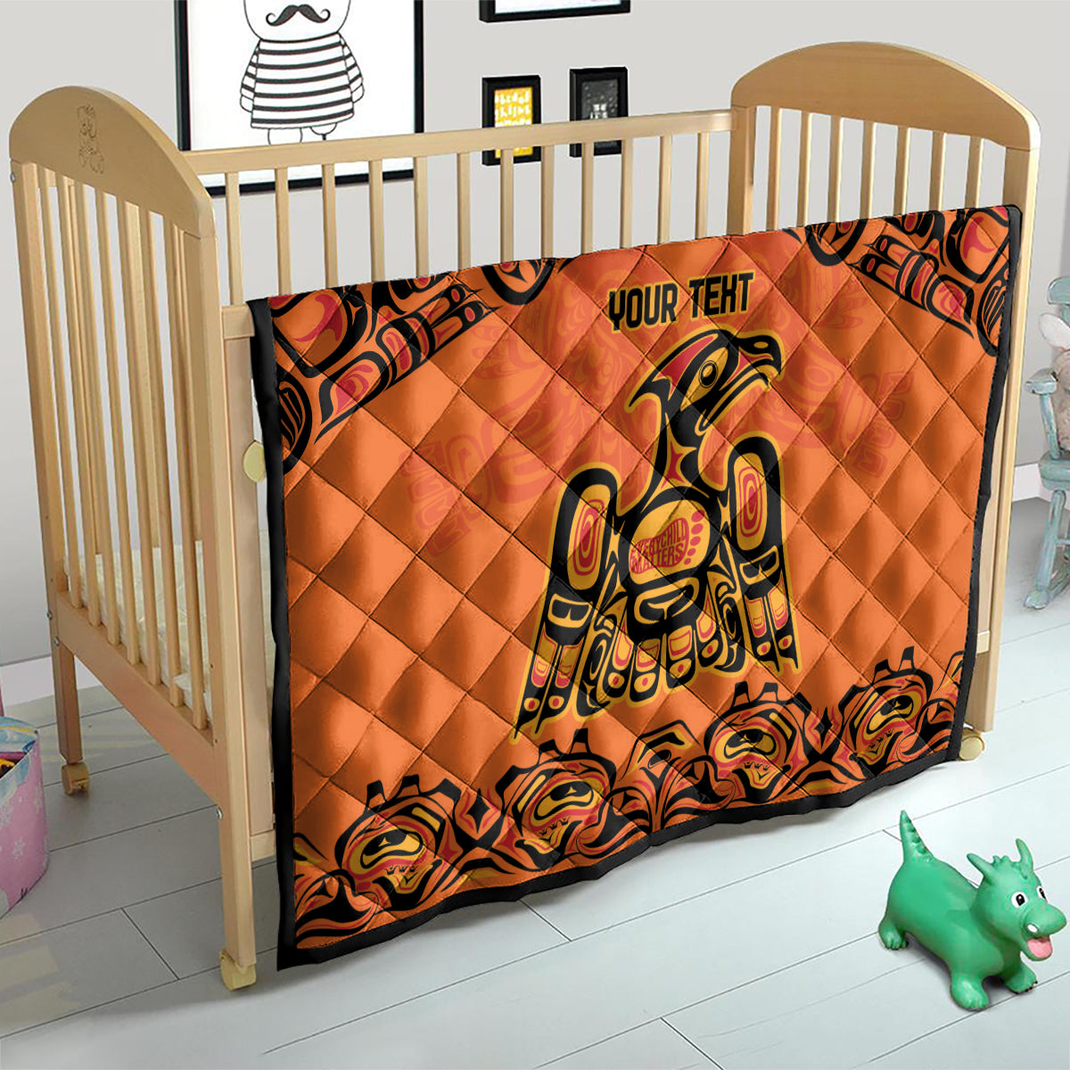 Orange quilt blanket with black border, Haida-style raven print and "YOUR TENT" text