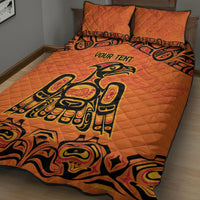 Orange quilt bed set with two pillow shams, large black tribal-style graphic on quilt