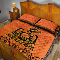 Orange quilt bed set with two pillow shams, black tribal-style motif and trim