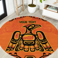 Round orange patterned area rug with eagle figure design and 'YOUR TEXT' in center