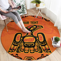 Round orange area rug with large eagle motif and 'YOUR TEXT' lettering across top