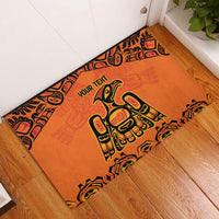 Orange rubber doormat with black tribal border and 'YOUR TEHT' text