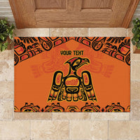 Orange rubber doormat with 'YOUR TEHT' and central yellow-green totem figure