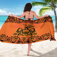 Orange personalized sarong spread open, showing large tribal pattern and 'YOUR TEHT'
