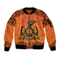 Orange unisex zip bomber jacket with Haida-style eagle graphic and ribbed cuffs