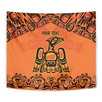 Orange wall tapestry close-up with black tribal border, 'YOUR TEXT', and bird emblem.