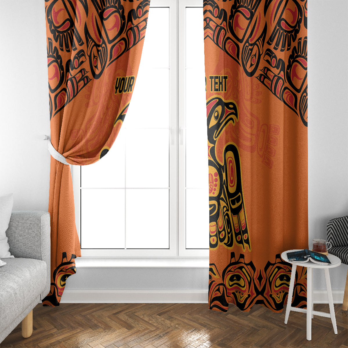 Orange curtain panels with black and yellow totem artwork, gathered top and hanging ties.