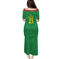 Green long off-shoulder dress, back shows yellow name text and number 21