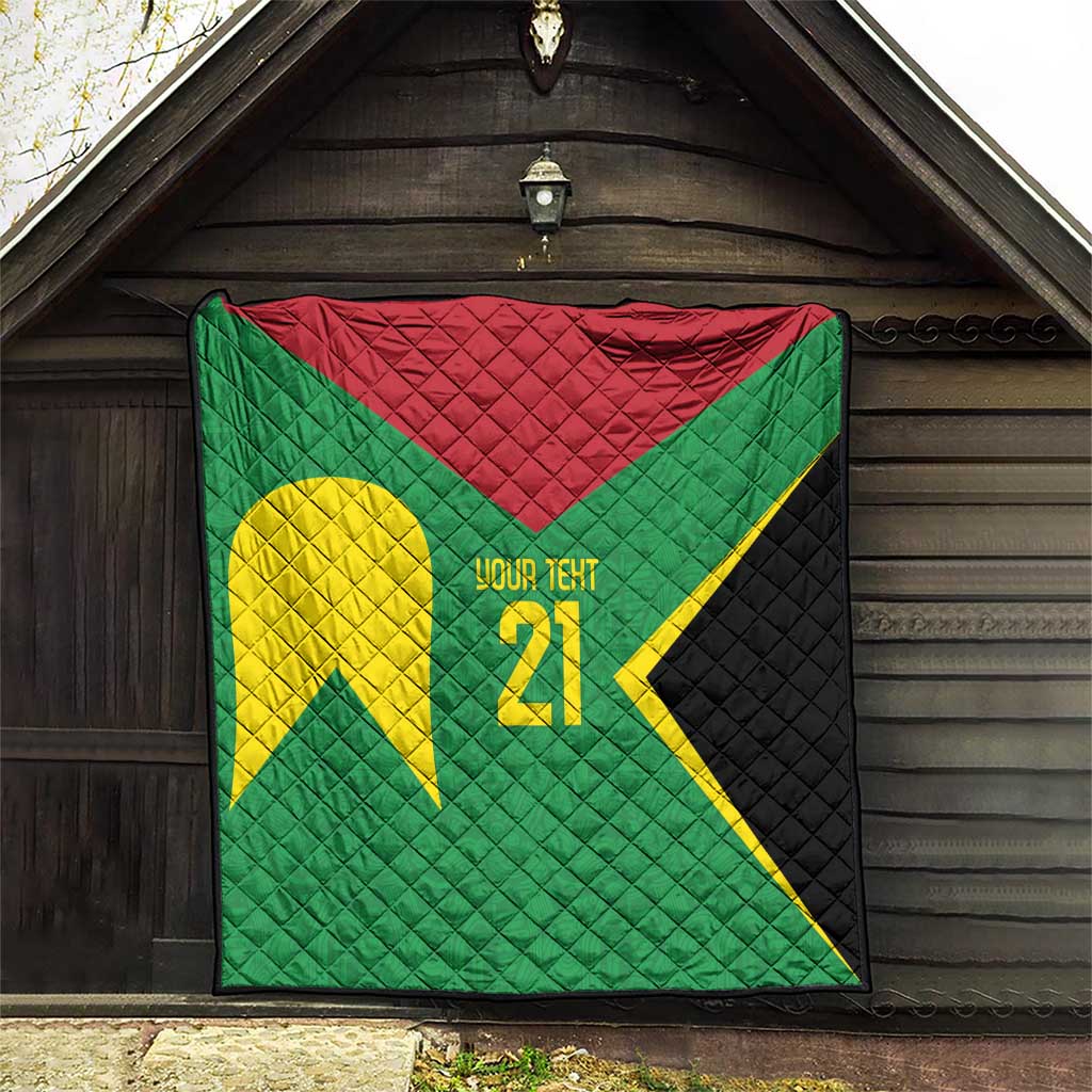 Green quilt with red top, yellow emblem, '21' text, and black quilted side