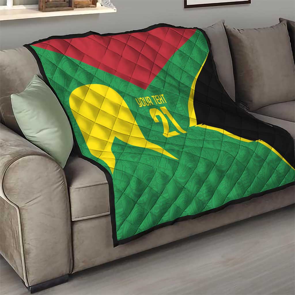 Green quilt on sofa with yellow emblem, '21' custom text, red header, black edge