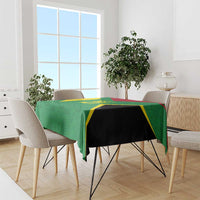 Green custom tablecloth with gold and black diagonal panel design on dining table