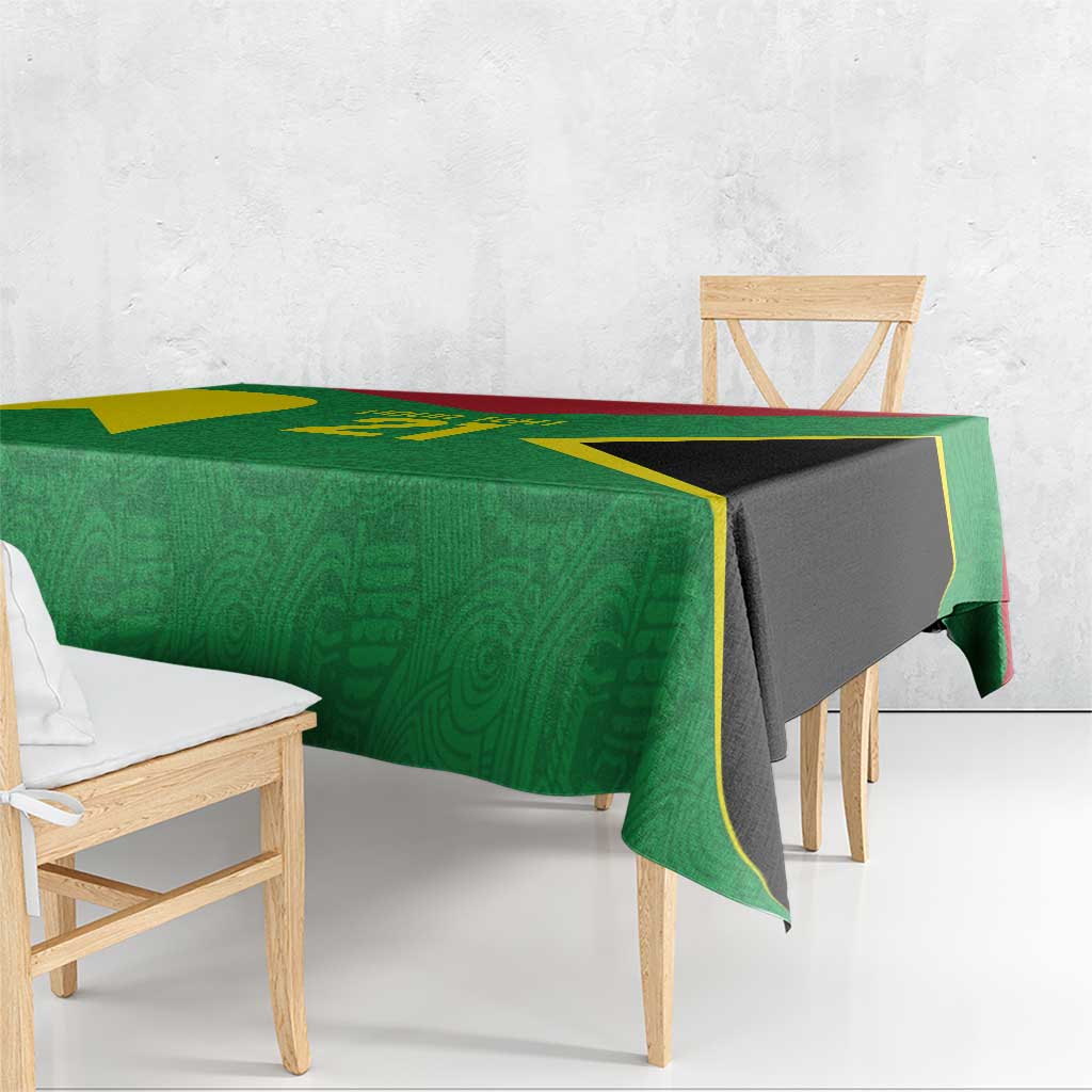 Green custom tablecloth with gold accents and black center panel, draped on table