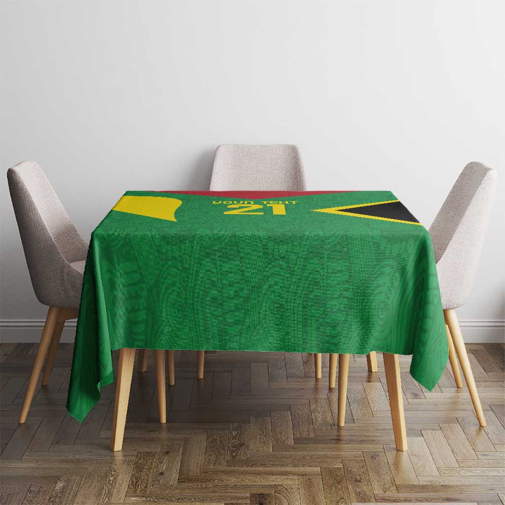 Green custom tablecloth on dining table with gold details and 'Your text 21' at center