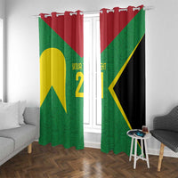 Green window curtains with red header and yellow/gold emblem print, hung with metal rings.
