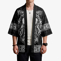 Black kimono with open front, white graphic sleeves and knot trim; worn on model.